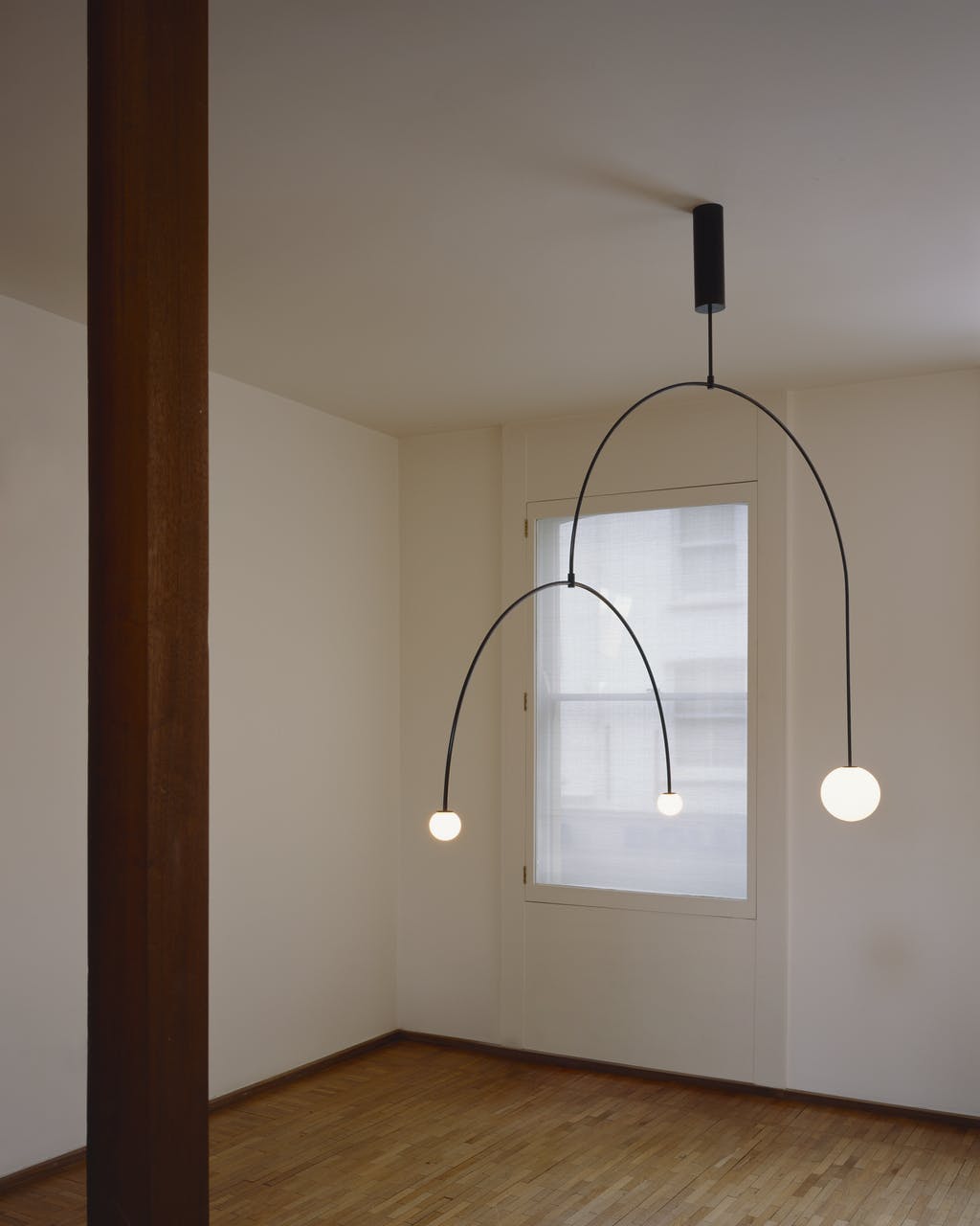 Mobile chandelier with glowing opaline glass diffusers detail