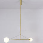 Mobile chandelier lit warmly above an open living space