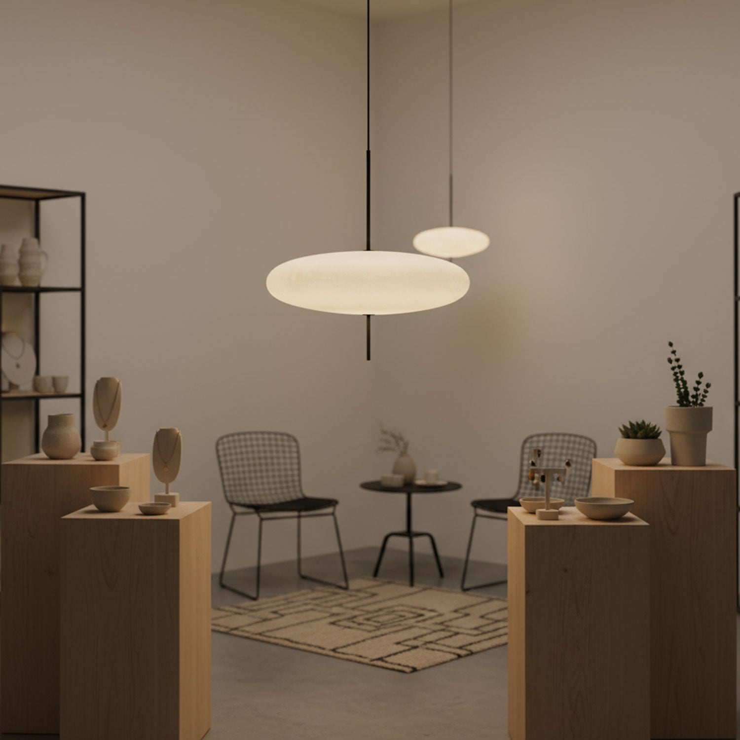 Disc pendant light with black body and white shade