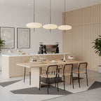 Opalescent pendant light hanging in a styled room