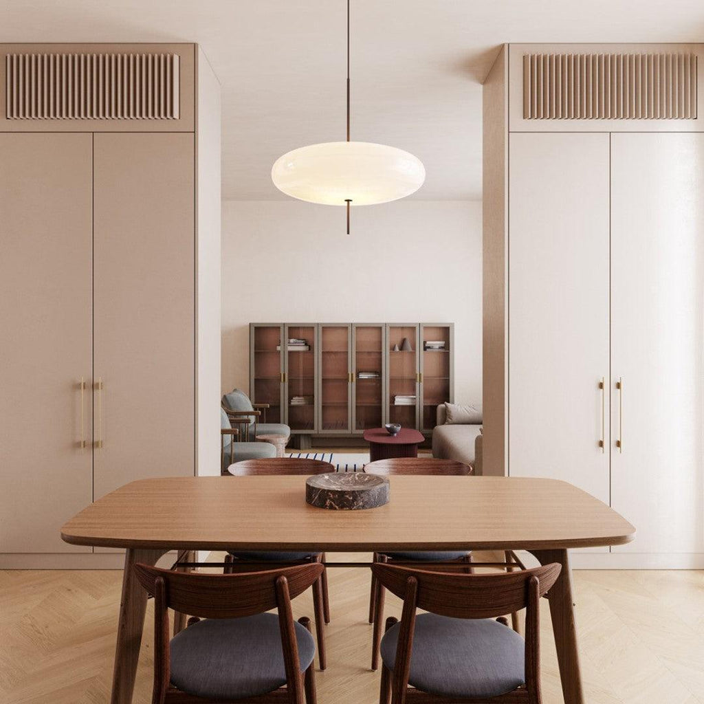 Elliptical pendant light shown in a modern interior