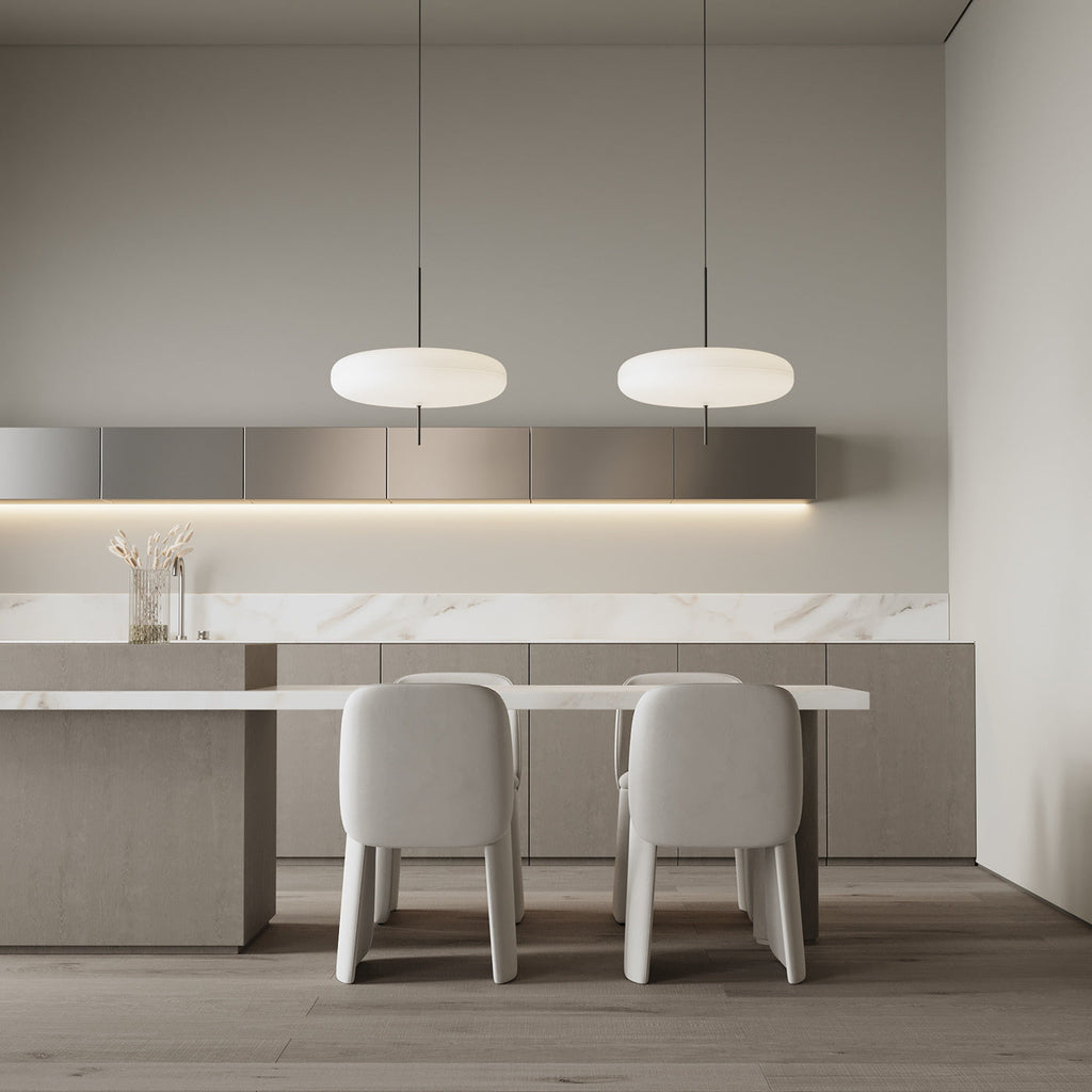 Opalescent disc pendant light in a styled interior
