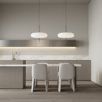 Opalescent disc pendant light in a styled interior