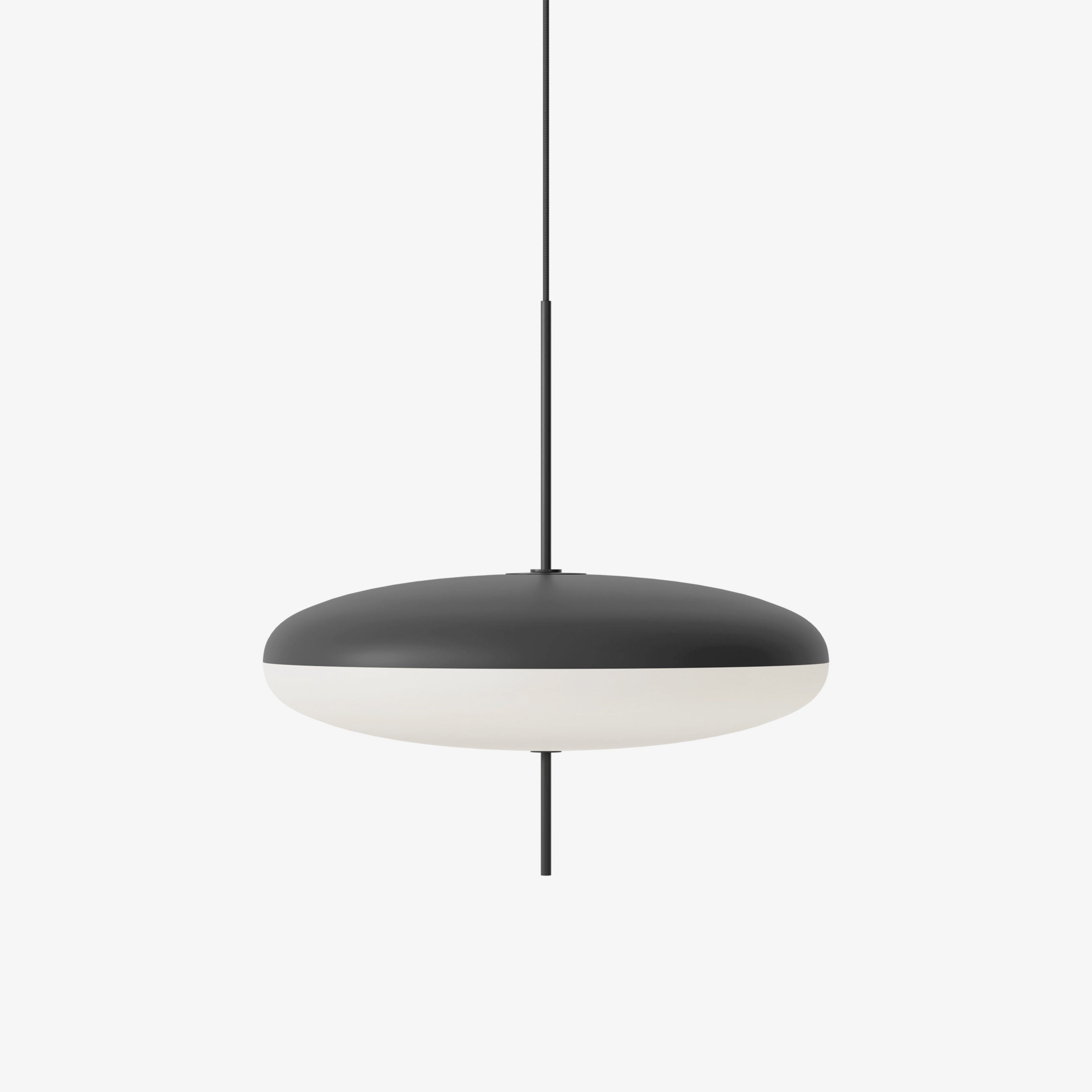 Opal disc pendant light suspended from a black canopy