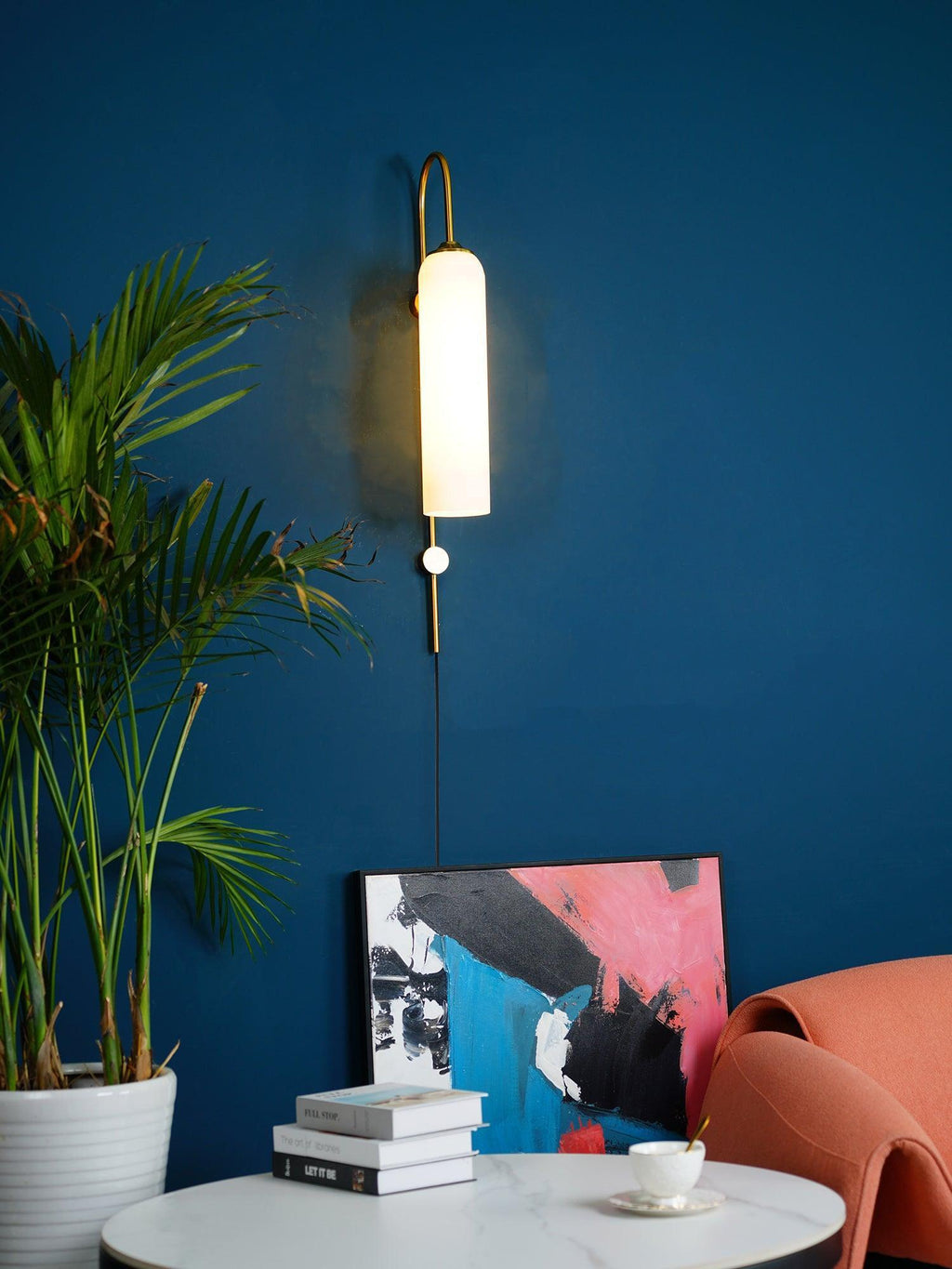 glass wall lamp room scene with the glass cylinder softly illuminated