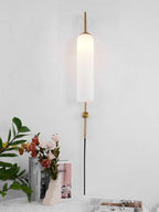 glass wall lamp glowing in a darkened room setting
