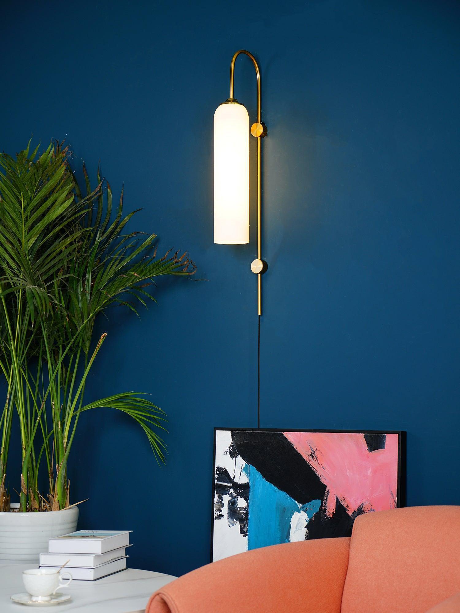 glass wall lamp in a living space, warm light through the glass shade