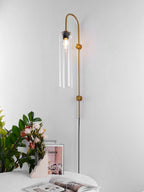 glass wall lamp mounted near seating as an ambient wall light