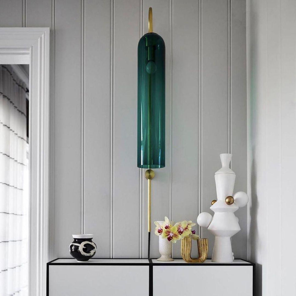 glass wall lamp room scene highlighting the slim metal frame