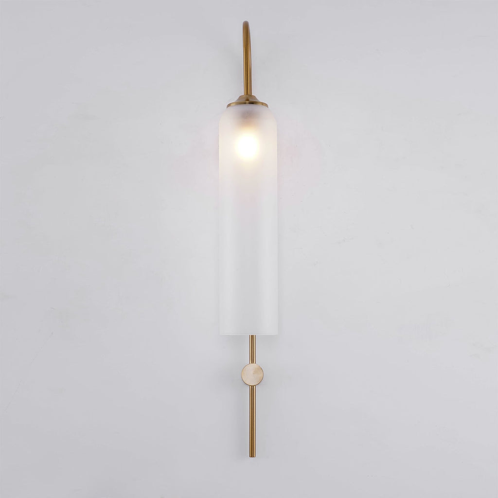 Modern glass wall lamp shown with warm glow in an interior