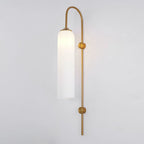 Modern glass wall lamp styled above a console table