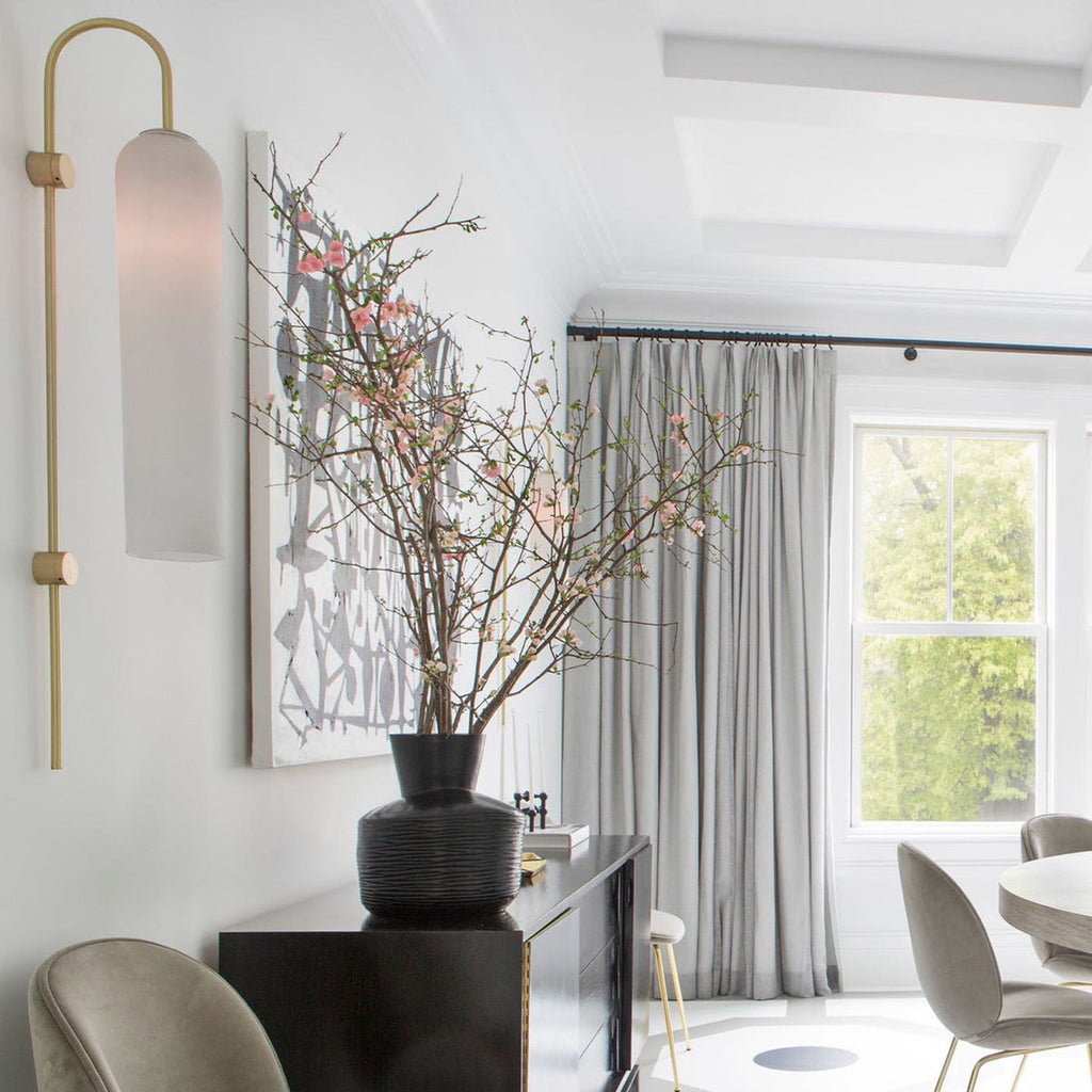 Modern glass wall lamp mounted with downward glow
