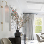 Modern glass wall lamp mounted with downward glow
