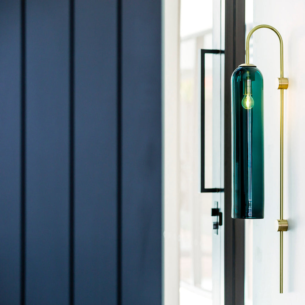 Modern glass wall lamp detail of the glass tube and arm