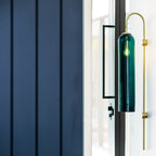 Modern glass wall lamp detail of the glass tube and arm