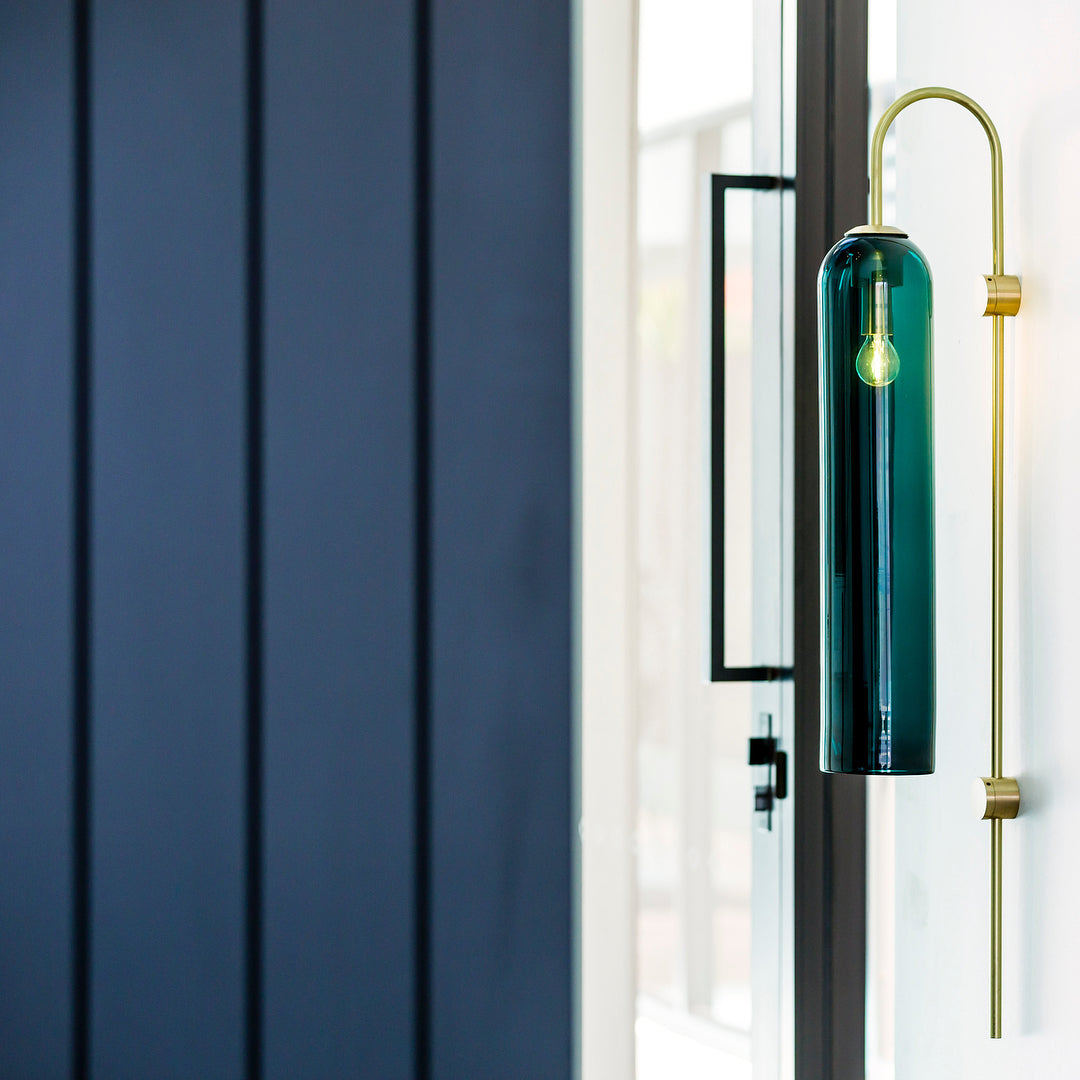Modern glass wall lamp detail of the glass tube and arm