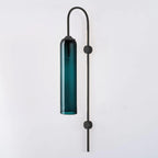 Modern glass wall lamp with black arm shown lit