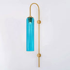 Modern glass wall lamp in a styled hallway setting
