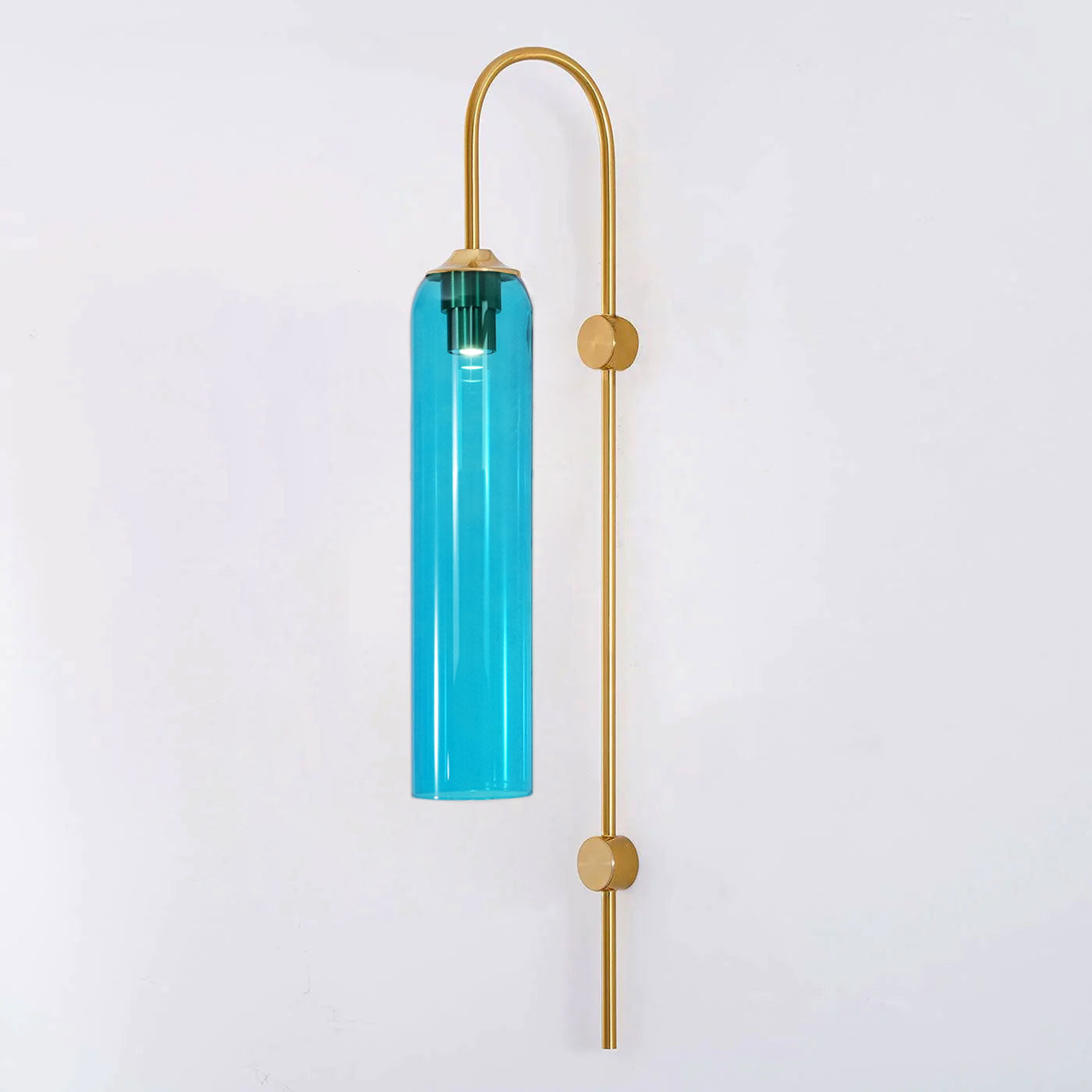 Modern glass wall lamp in a styled hallway setting