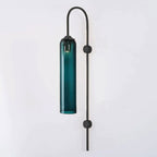 Modern glass wall lamp lit detail of the cylinder shade