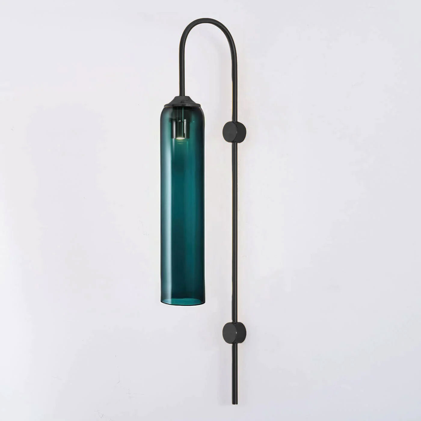 Modern glass wall lamp lit detail of the cylinder shade