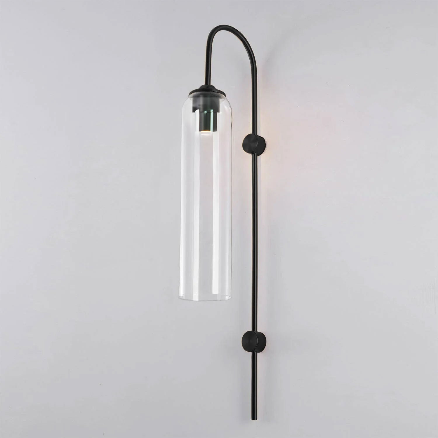 Modern glass wall lamp with warm glow through the glass tube
