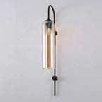 Modern glass wall lamp close-up of the brass arm curve
