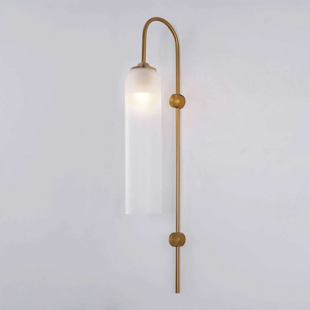 Modern glass wall lamp mounted above a console