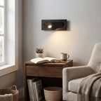 LED bedside reading light with adjustable head aimed at a page