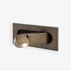 Modern LED bedside reading light glowing warm white at the headboard