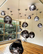 Lava pendant lamp illuminated showing mesmerising mirror look