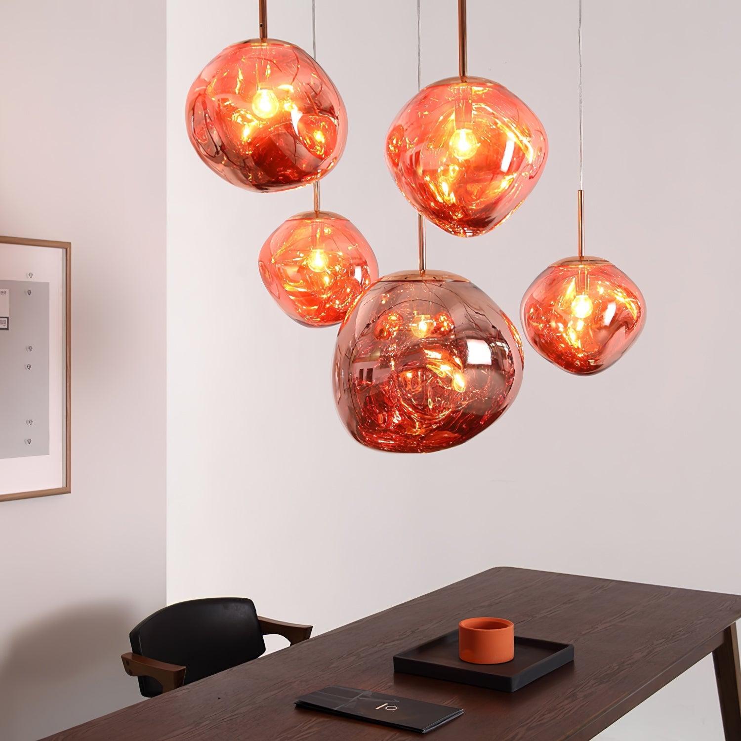 Modern lava pendant light glowing with reflective interior