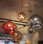 Modern lava pendant light reflecting light across a room