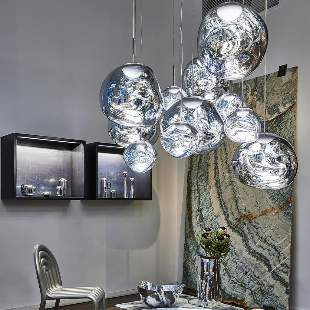 Lava pendant light with gold mirror shade over a reading nook