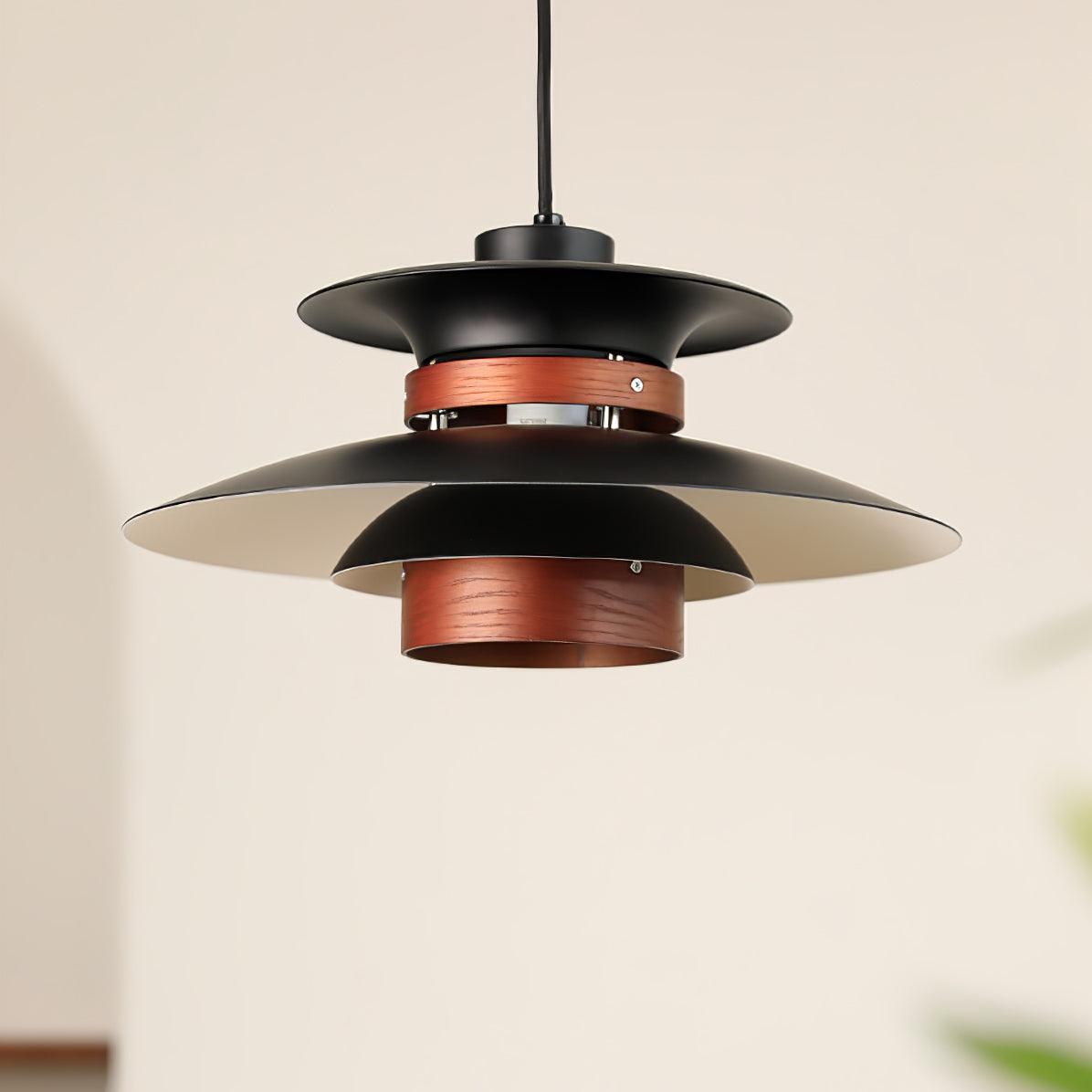 Angled view of the black shades and walnut ring on this Clérachic pendant, seen from below.