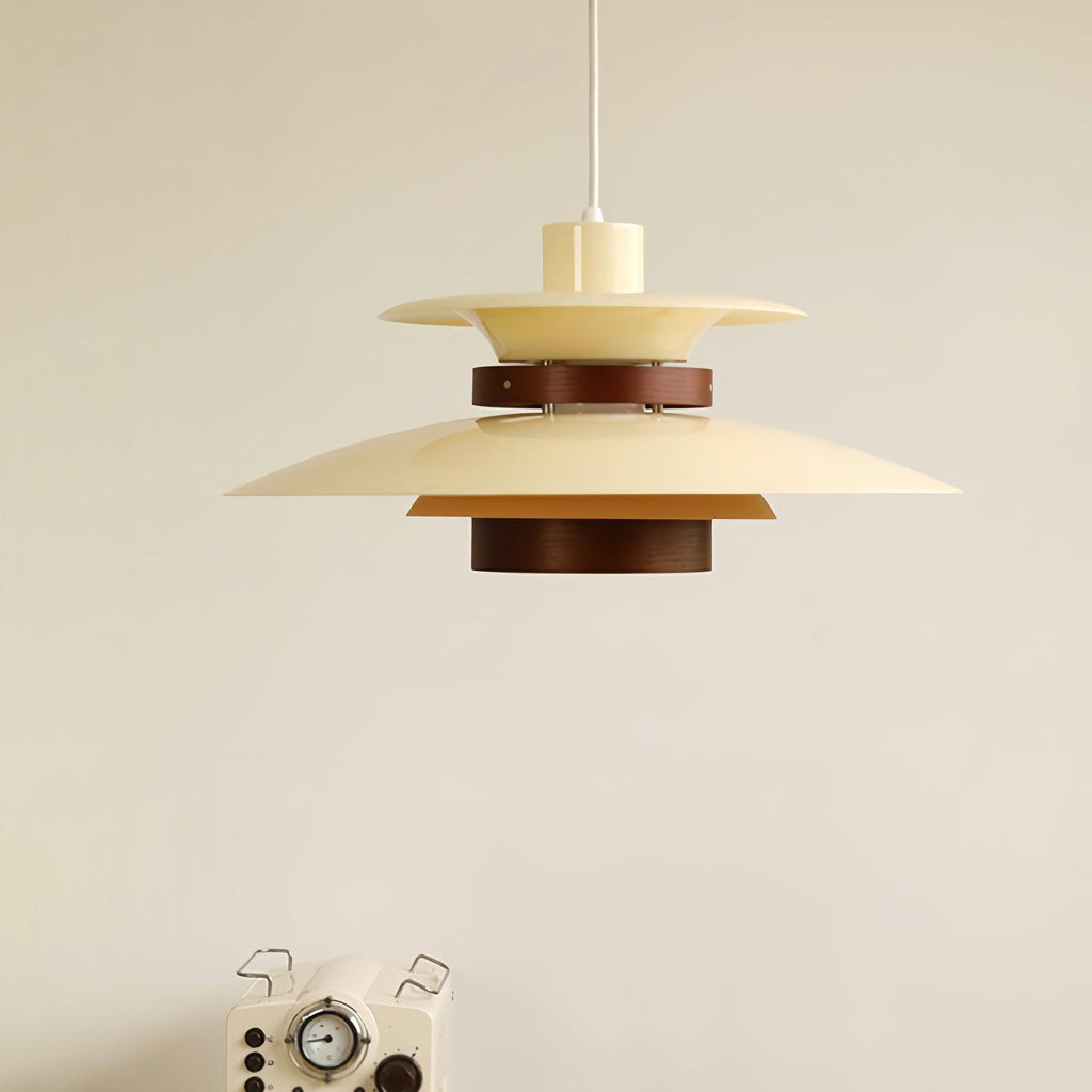 Close view of a beige Clérachic pendant hanging above a vintage-style radio prop.