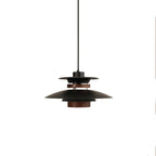 Side view of the black shades and walnut ring on this Clérachic pendant, on white.