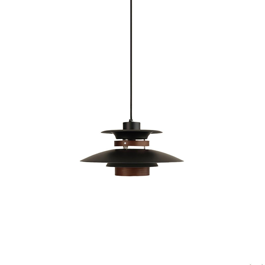 A small black Clérachic pendant with a walnut ring, shown on a plain white backdrop.