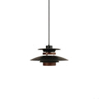 A small black Clérachic pendant with a walnut ring, shown on a plain white backdrop.
