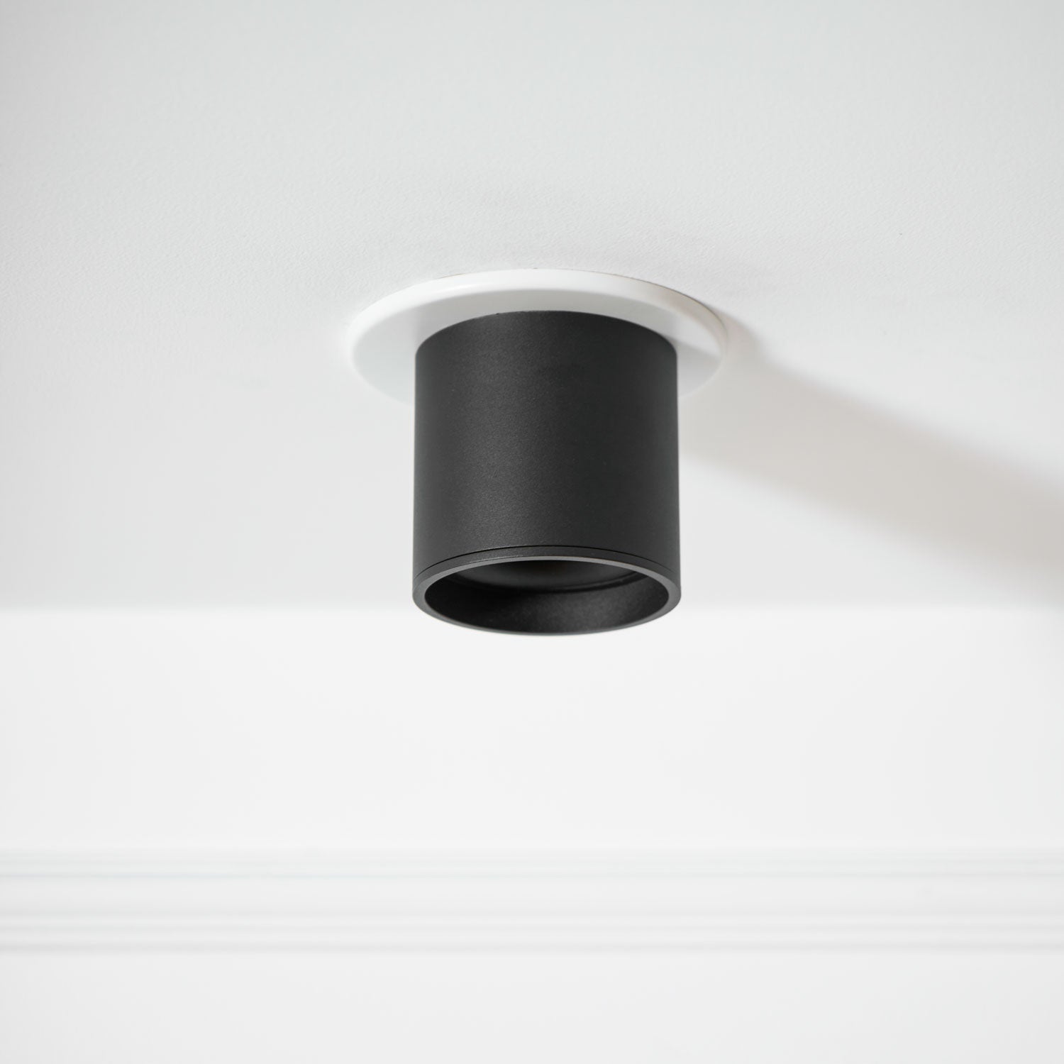 Modupoint ceiling light with a deep ridged rim mounted on a modern ceiling