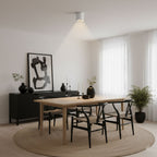 Modupoint ceiling light in white casting an even, low-glare pool of light