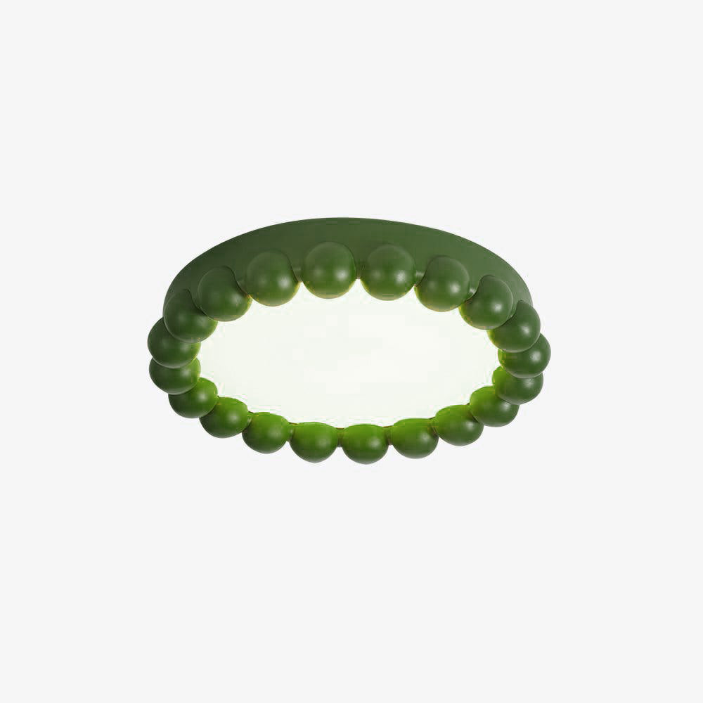 Close view of this Clérachic ceiling light in green, its beaded resin ring shown unlit on white.