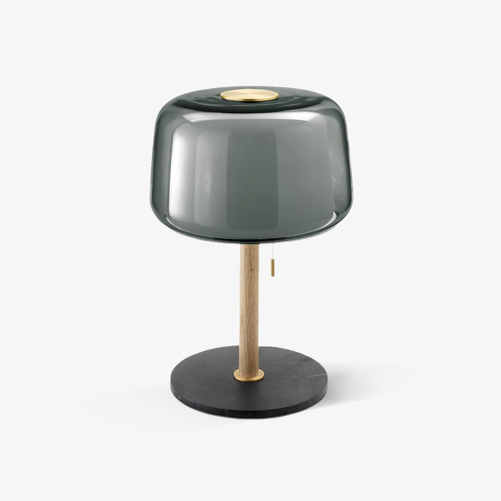 Clérachic lamp with a smoked-grey glass shade on an oak stem and black marble base, shown alone against a pale backdrop.