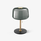 Clérachic lamp with a smoked-grey glass shade on an oak stem and black marble base, shown alone against a pale backdrop.