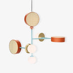 Five-arm Clérachic chandelier in rust, teal and blush cane drums, photographed complete against a plain white studio background.
