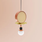 Single-arm Clérachic pendant with a copper cane drum, brass disc, dark bead joint and opal glass globe, shot against a blush pink background.