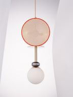 The same Clérachic pendant against the angled white wall, photographed from a slightly wider angle showing more of the glass globe.