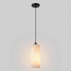 Monty alabaster pendant glowing warm through the natural stone shade