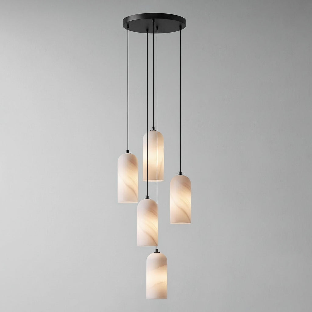 Monty alabaster pendant 5-head cluster lit over a table