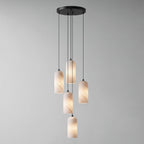 Monty alabaster pendant 5-head cluster lit over a table